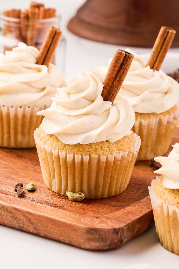 Chai cupcakes on a cutting board.